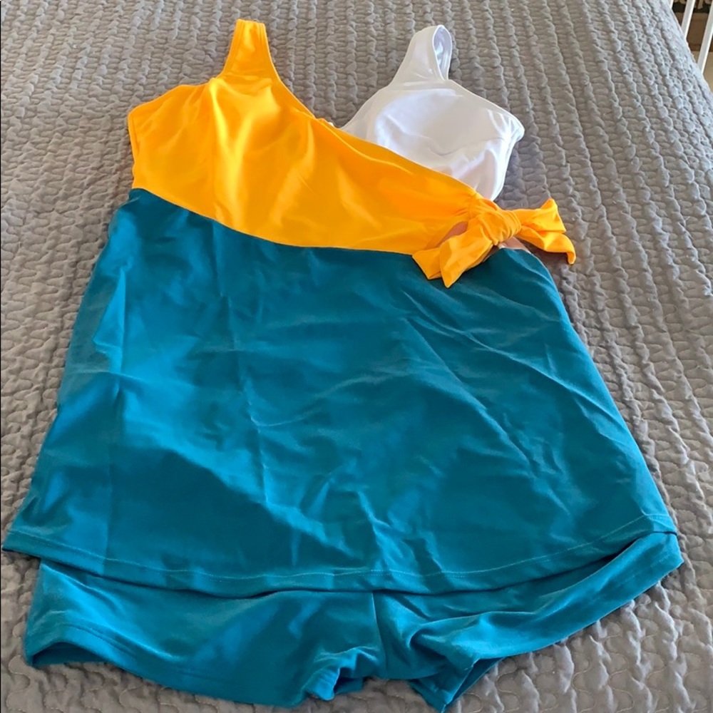 2 piece dress bathing suit. Never worn.